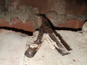 Severely corroded bitumen fishtail tie exposed in outer leaf wall.