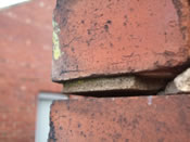 Severe horizontal cracking occurring as a result of wall tie corrosion