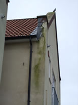 Severe penetrating damp issues caused by poor parapet wall detail