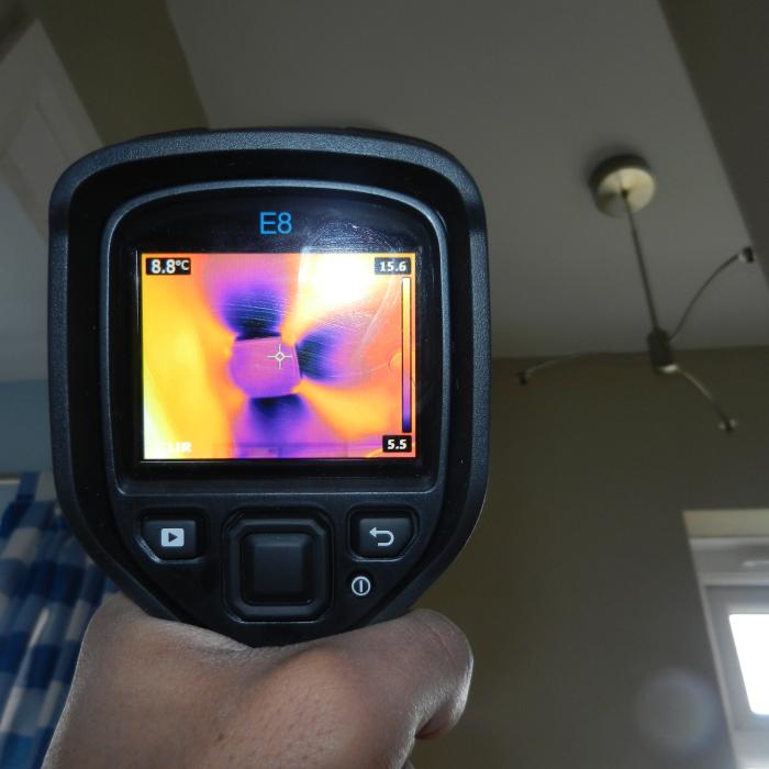 This is a thermal image taken of a Positive Input Ventilation (PIV)  system installed into the first floor landing ceiling of a property  which had previously been suffering with issues of condensation.  The  Positive Input Ventilation system is designed to filter air from the  loft space of the building into the property through a diffuser and G4  filter which distils the stale air within the property forcing it out  through natural ventilation sources and creating valuable air exchanges.  The results are noticeably better atmospheric conditions and a lesser  risk of issues with condensation.  The images shows the cooler air from  within the loft space being distributed by the diffuser on the ceiling.
