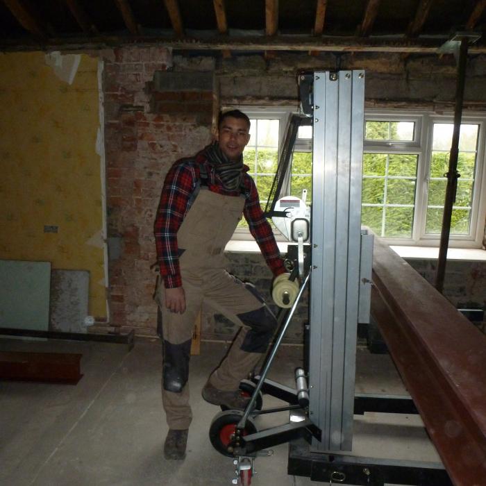 Dryfix M.D. and Surveyor Russell Rafton onsite to supervise and lend a hand during huge steel installation. 
A project in Tadcaster where we have removed all the internal dividing walls to create one large  Kitchen / Dining room area. The specification is one large room with a vaulted ceiling perimeter and central well to include exposed French Oak beams. The existing fire place in addition to the chimney stacks at roof level will be completely dismantled and rebuilt including a log burning stove. Extensive rebuilding of the walls is required for this project in addition to support of the entire roof structure, wall plate and window openings. Large steel beams weighing in excess of 1 1/2 tonne each will be required to created the vaulted ceiling in addition to new steel work above all the window openings and roof structure . The existing roof structure will have a new roof frame built internally to create the shape of the vault in addition to providing support to the original roof and the whole roof is to be treated against wood boring inspects (woodworm). The entire room is also to be damp proofed and all walls re-plastered, including huge amounts of high specification insulation to be introduced into the roof and ceilings. . See following pictures of progress.  All work was completed by the Dryfix Team. 
 