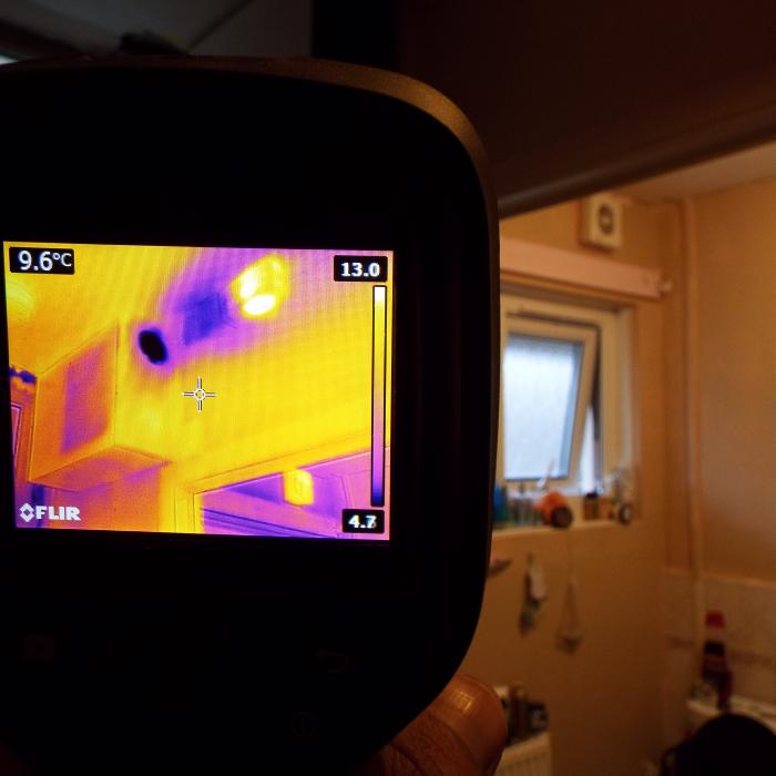 This is a thermal image taken of a Positive Input Ventilation (PIV)  system installed into a ground floor appartment  which had previously been suffering with issues of condensation.  The  Positive Input Ventilation system is designed to filter air from the building into the property through a diffuser and G4  filter which distils the stale air within the property forcing it out  through natural ventilation sources and creating valuable air exchanges.  The results are noticeably better atmospheric conditions and a lesser  risk of issues with condensation.  The images shows the cooler air from ouside being distributed by the diffuser.