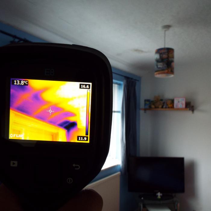 

Cold air intrusion, the darker area of the eves ceilings in this image shows a clear difference in temperature between the eve and the main ceiling area, which is caused by cold air intrusion. The roof space is often ventilated via the soffits allowing air to migrate into the roof through louvered vents in the soffit. Often insulation within the roof is withdrawn from the eves as too not compromise the incoming air and ventilation, as a consequence however the result is a warm ceiling with a cold perimeter adjacent the eve as is clearly shown in this image. The significant reduction in temperature makes the eve of the ceiling particularly vulnerable to condensation and mould issues, very common in properties with eve ceilings which protrude into the first floor rooms below where often there is little or no insulation at all.
