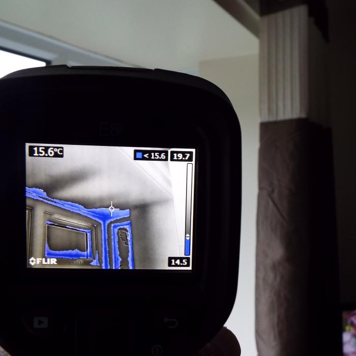 

Thermal imaging combined with atmospheric monitoring allows us to programme and establish the area’s most at risk of condensate and mould issues when establishing the dew point temperature. Here you can see the ceiling and window reveals of this bay window which are within the region of the dew point temperature and are highlighted in the greyscale image in blue.
