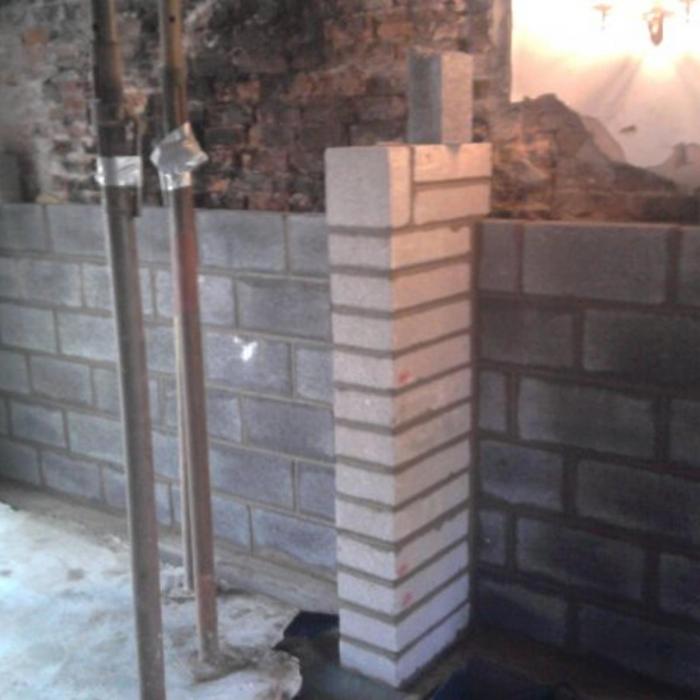 Dryfix structural repair involving erecting a structural inner leaf wall to a three story gable discovered to be constructed from only 100mm brickwork. This repair involved new foundations for the new internal wall, erection of new supporting pillars to support steels where internal walls had previously been removed in addition to tying the original gable wall to the new inner wall.  